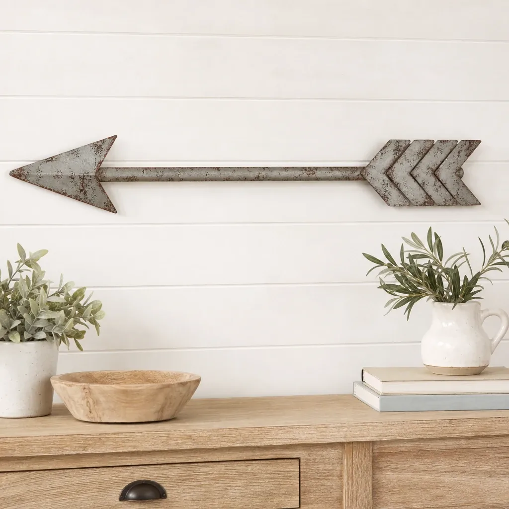 Alternate view of Distressed Metal Arrow styled on a softly lit farmhouse surface