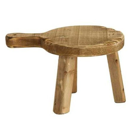Round wooden pedestal with a carved top, side handle, and short legs